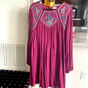 Never worn, new short dress up to the knees with beautiful embroidery